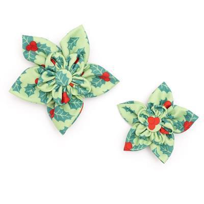 Two green floral collar bows with red heart details on a white background