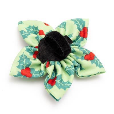 Christmas-themed collar bow with holly design on a white background