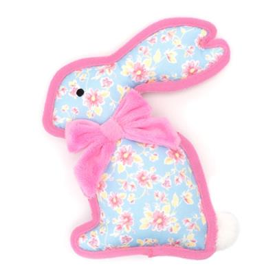 Floral-patterned bunny toy with a pink bow on a white background