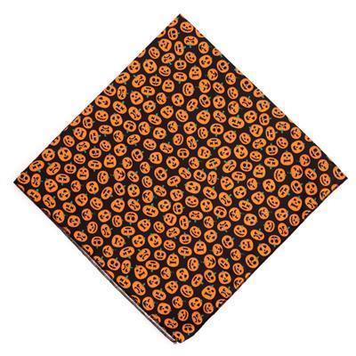 Halloween-themed fabric with orange pumpkins on a black background