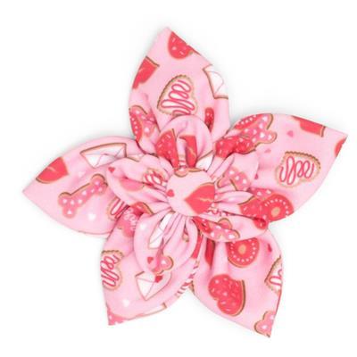 Pink collar bow with hearts & bones pattern on a white background