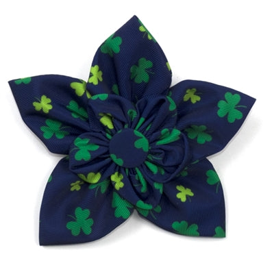 Navy blue flower dog collar flower with green shamrock patterns on a white background