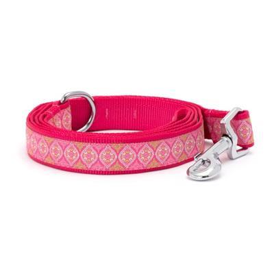 Pink dog leash with decorative pattern on a white background