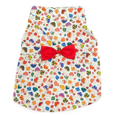 Patterned dress with colorful mushrooms and a red bow on a white background