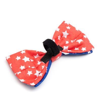 Red and white star-patterned bow tie with a black Velcro touch closure on a white background