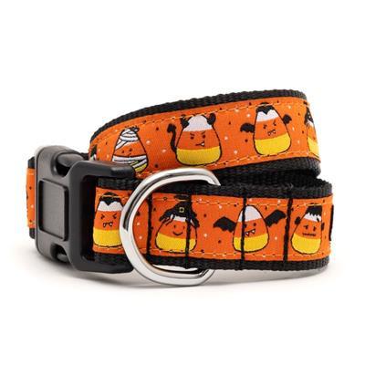 Halloween-themed dog collar with candy corn and ghost design on an orange background.