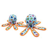 Colorful octopus-shaped toy with cartoon faces on a white background