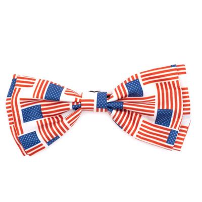 A bow tie with a patchwork flag pattern, predominantly red and blue, likely designed for pets.