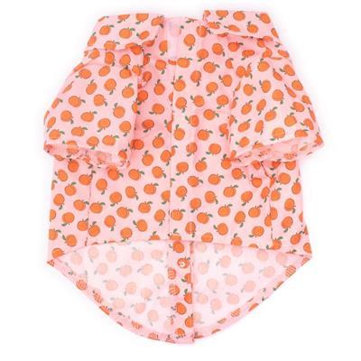 Pink fabric with orange peach pattern on a white background