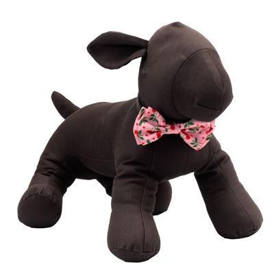 Brown plush dog toy with a pink bow tie on a white background