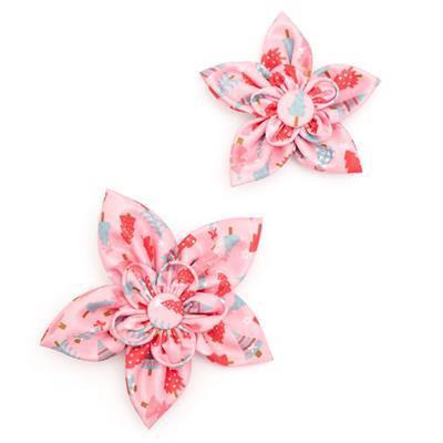 Two pink floral collar bows on a white background