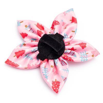 Pink floral collar bow with black center on a white background