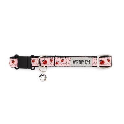 Cat collar with ladybug pattern and 'Worthy Cat' branding on a white background
