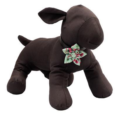 Brown plush dog toy with a floral bow on a white background