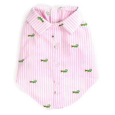 Pink striped shirt with green alligator patterns on a white background