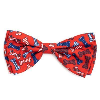 Red bow tie with blue and white bone pattern on a white background