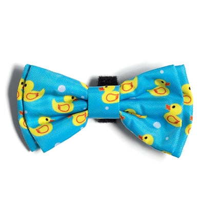 Blue bow tie with yellow rubber duck pattern on a white background