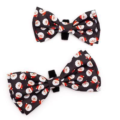 Two black bow ties with Santa Claus pattern on a white background