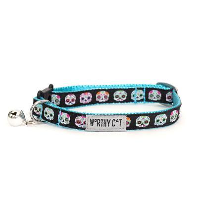 Cat collar with colorful skull pattern on a white background