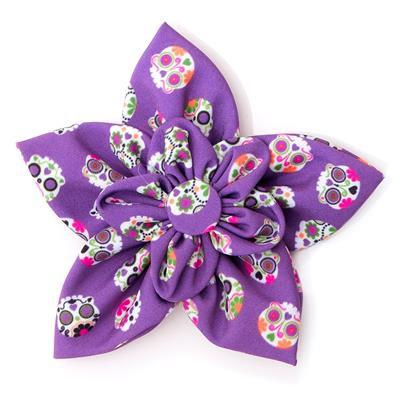 Purple flower-shaped collar flower with colorful sugar skull pattern on a white background