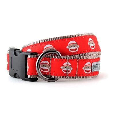 Red dog collar with monkey pattern on a white background