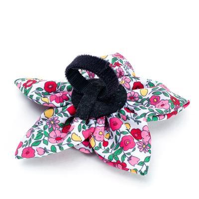 Floral-patterned dog collar accessory with velcro closure on a white background
