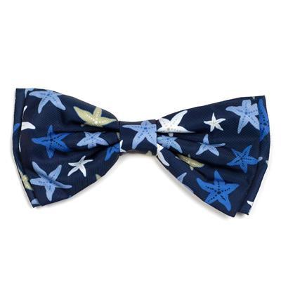 Navy blue bow tie with starfish pattern on a white background