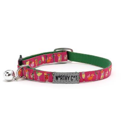 Cat collar with colorful design, bell and 'Worthy Cat' tag on a white background