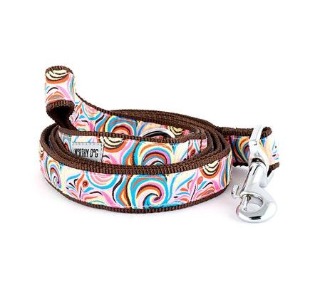 Colorful dog leash with a brown handle on a white background