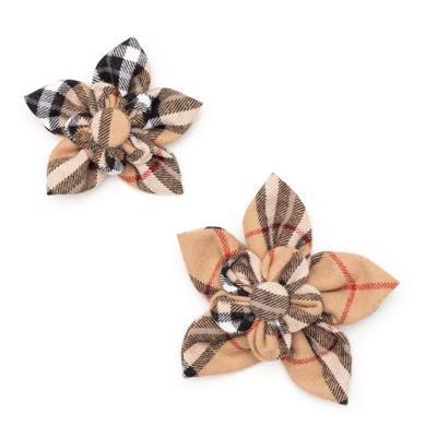 Two plaid flower-shaped collar accessories on a white background