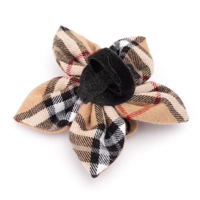Plaid bow collar accessory with black center on a white background