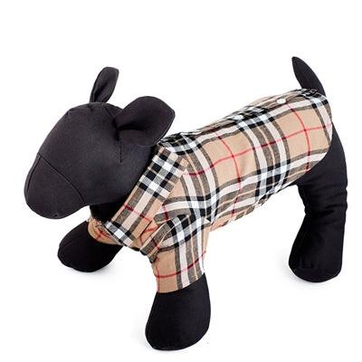 Dog mannequin wearing tan plaid dog shirt on white background