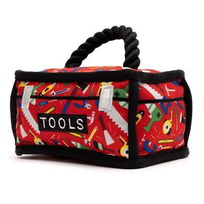 Red tool box dog toy with colorful tool pattern, rope handle and 'TOOLS' label on a white background
