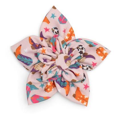 Colorful dog collar flower with western print on a white background