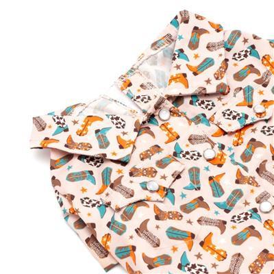 Dog shirt with cowboy boot and hat patterns on a white background