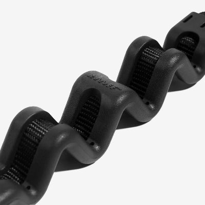 Close-up of a black shock absorbing leash on a white background