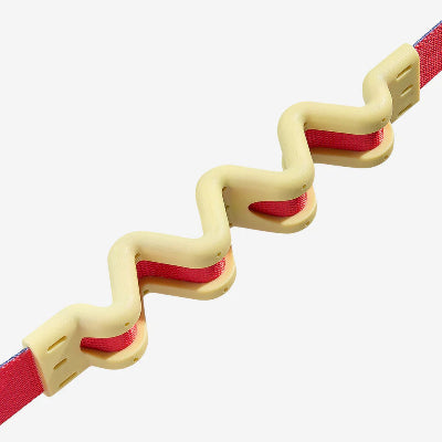 Zigzagging shock absorbing leash with red interior on a white background