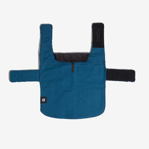 Back view of blue dog coat with velcro closures, leash hole and Zee.Dog logo on white background.