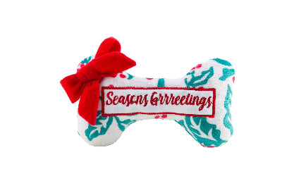 Dog toy with 'Seasons Greetings' text and red bow on a white background