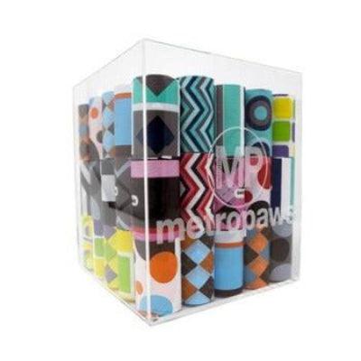 Collection of patterned dog poop bags in a clear cube with 'metropaws' branding.
