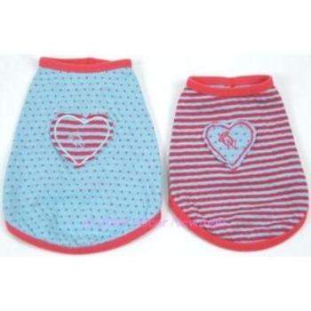 The Oscar Newman Heart Felt Reversible Dog Tee includes one light blue tee with polka dots and a striped heart patch, and a pink tee with horizontal stripes featuring a blue heart patch with red trim. Both are made from soft cotton for your pets comfort.